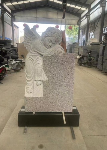 Grey Granite Headstone With A White Angel Statue